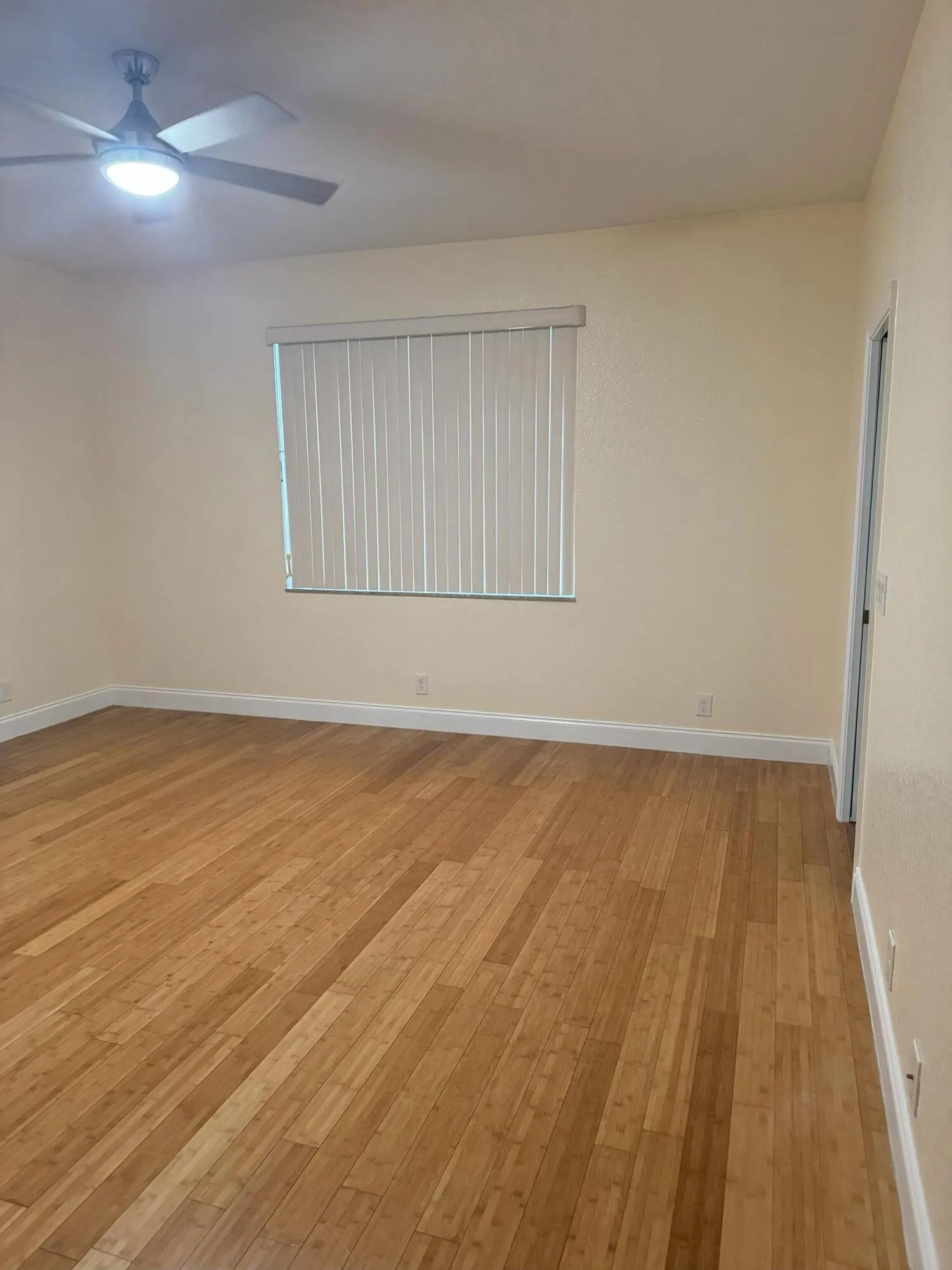 BEDROOM WITH WOOD FLOORS