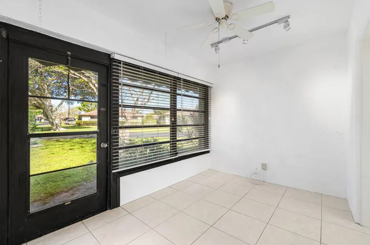Sun room with door to backyard