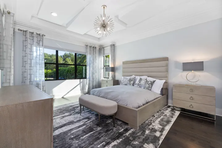 Spacious master bedroom with view of the pool