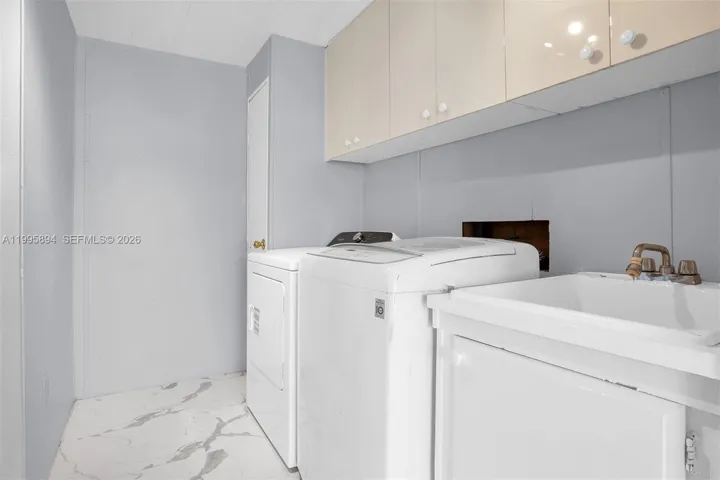 Laundry area with extra storage.