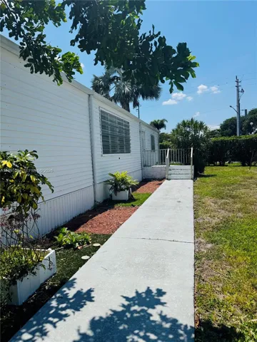 A peaceful setting with lush greenery, wide walkways.