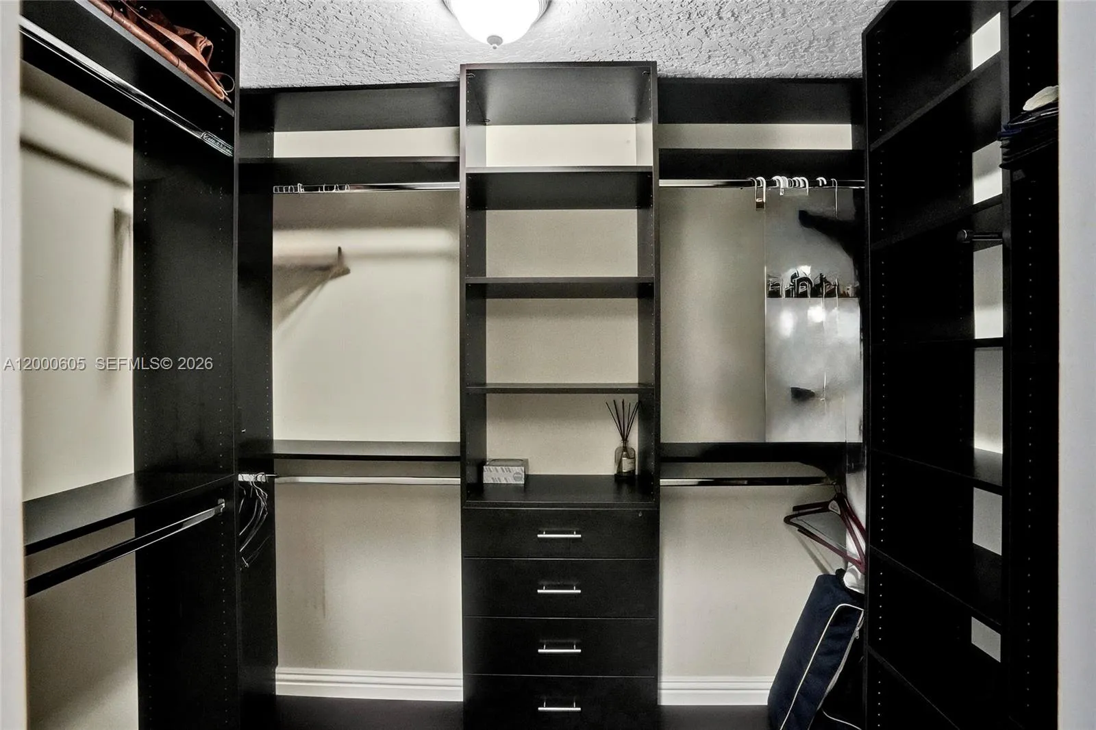 PRIMARY CLOSET W/BUILT INS