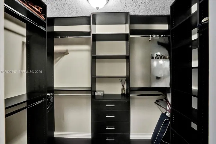 PRIMARY CLOSET W/BUILT INS