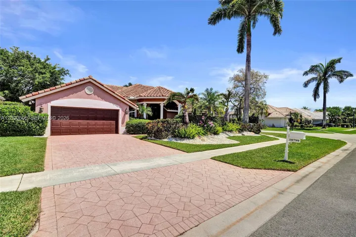 GORGEOUS CORNER LOT! 2 CAR GARAGE WITH MAGNIFICENT LANDSCAPING!