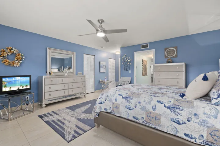 VIEW OF CLOSETS LEADING TO BATH