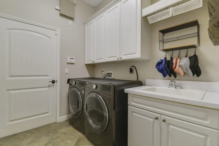 laundry with storage and wet sink