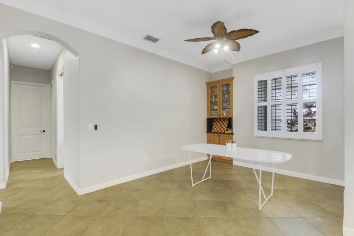 Formal dining or game room with built-in cabinet