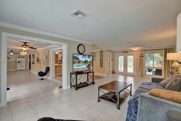 Living room connects to family rom, dining room and kitchen