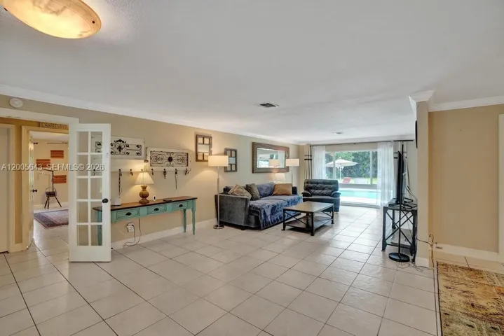 French doors to the hallway provide privacy