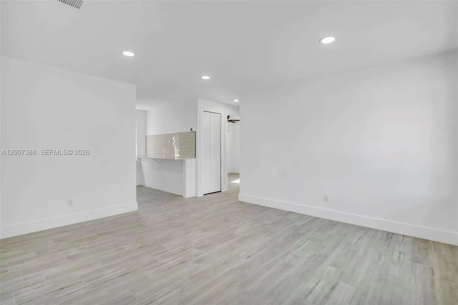 Living room leading into Kitchen
