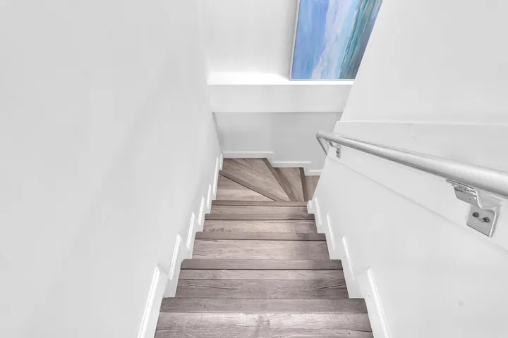Stairs leading down to bedrooms