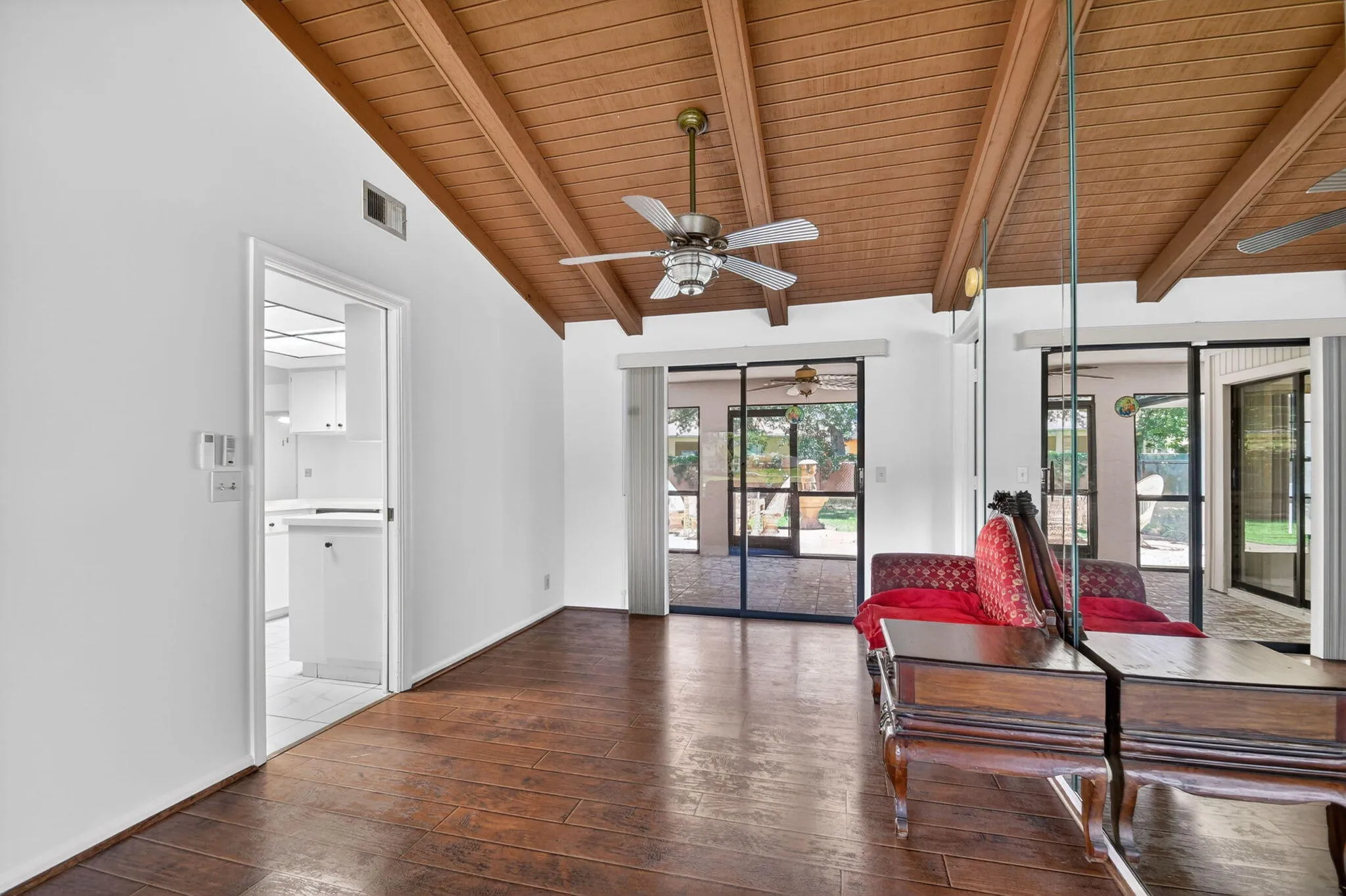 Dining room has sliding glass doors that open to the enclosed patio