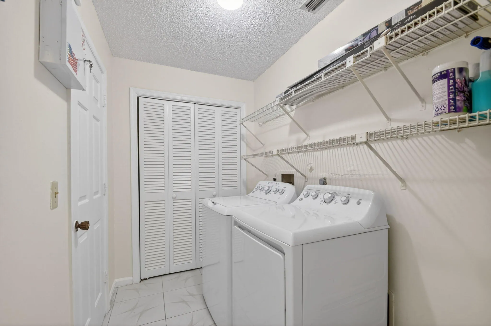 Laundry room has the added bonus of a closet for extra storage