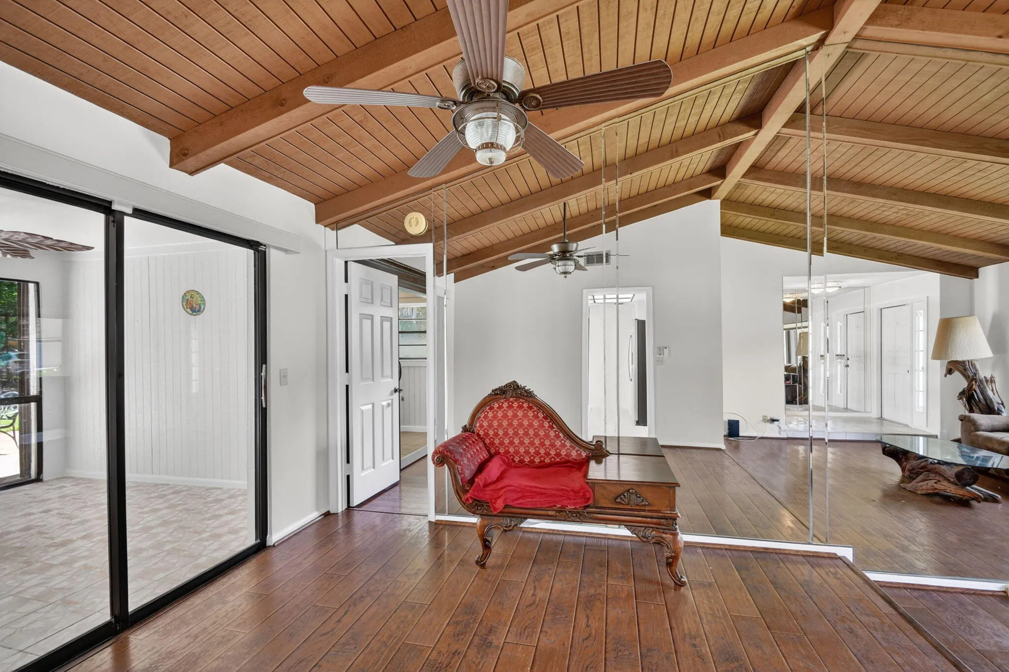 Dining room has sliding glass doors that open to the enclosed patio