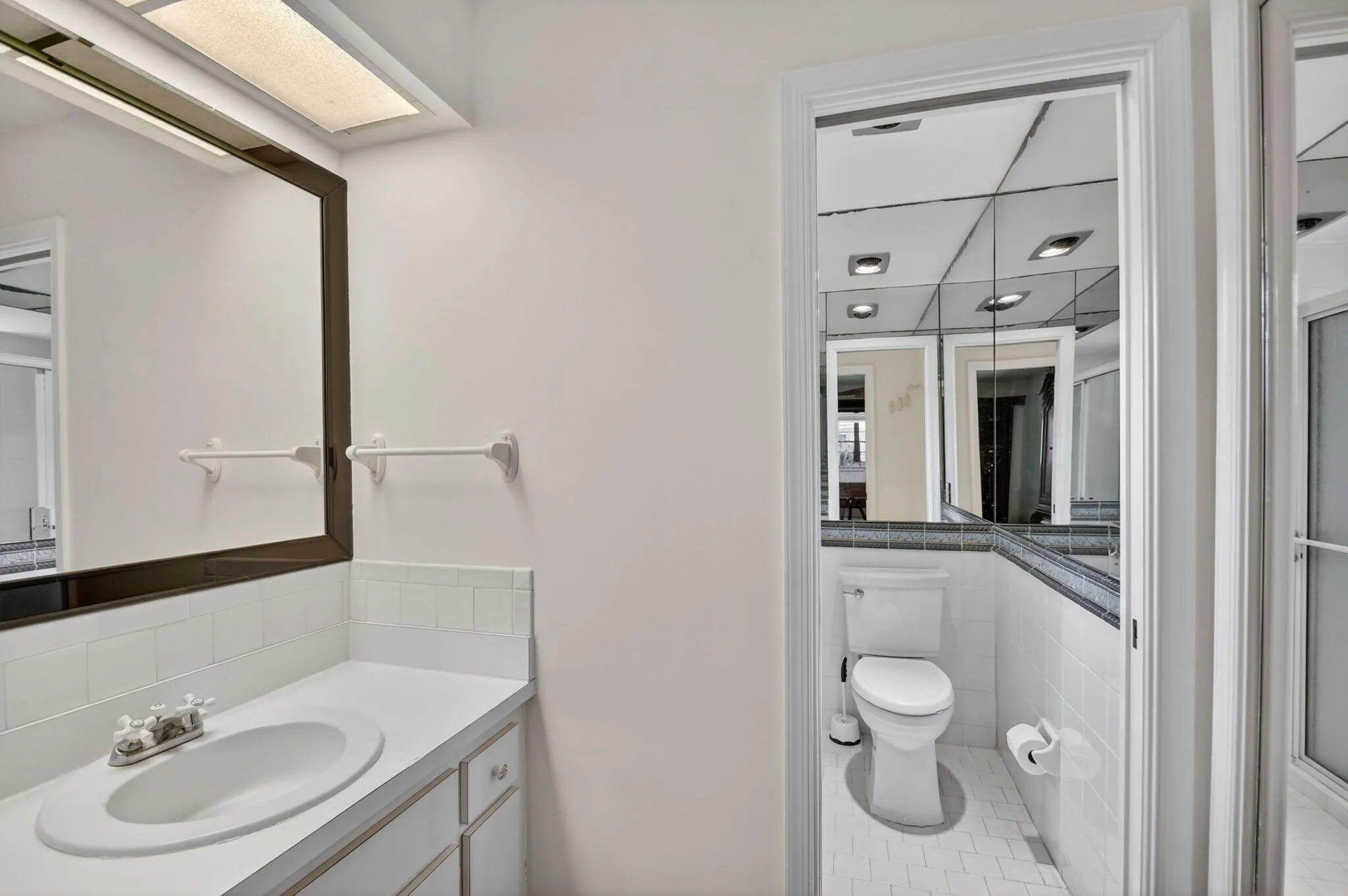 Primary bathroom has a step in shower