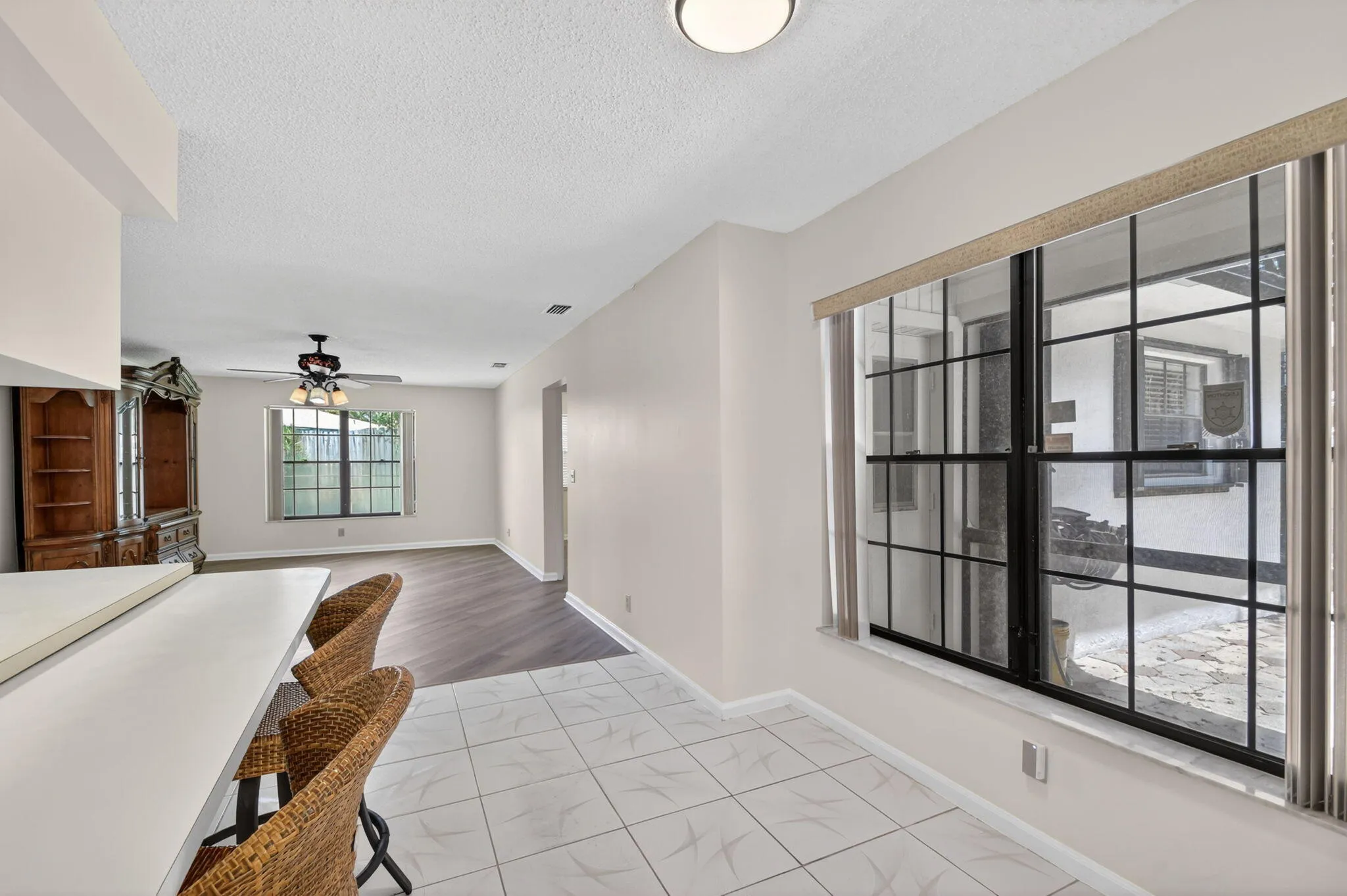A view from the kitchen/breakfast bar into the family room