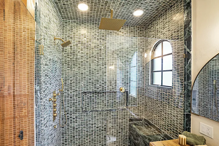 Marble shower with glass enclosure