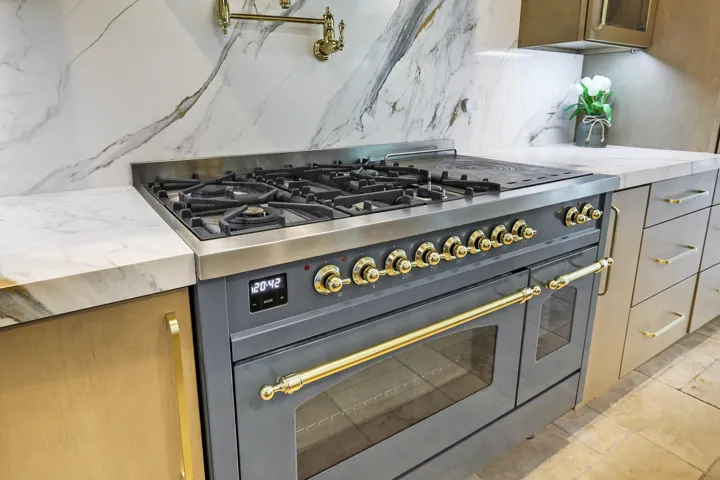 48” Ilve (Italian) propane stove & electric dual ovens with french griddle, reverse osmosis water system for pot filler and sink