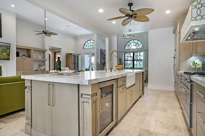Beverage Fridge, soft close drawers and roll-out cabinets, undermount and decorative cabinet lighting