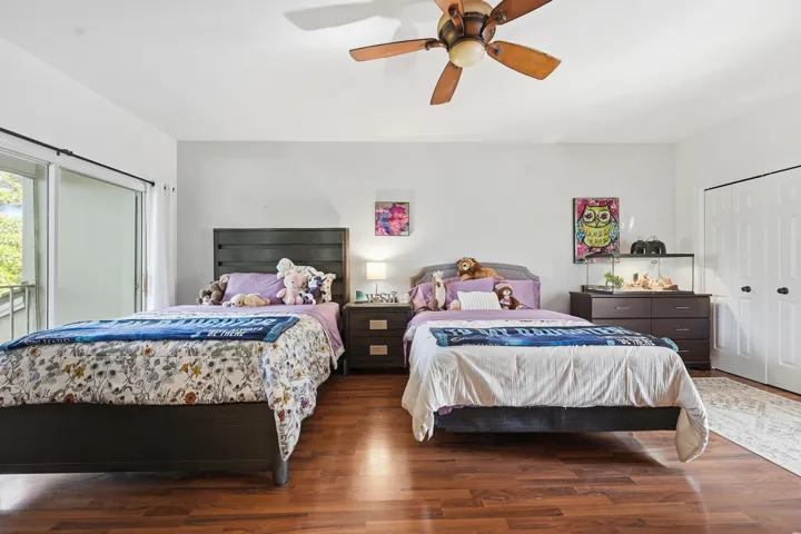 Large primary bedroom currently occupied by 2 queen beds.