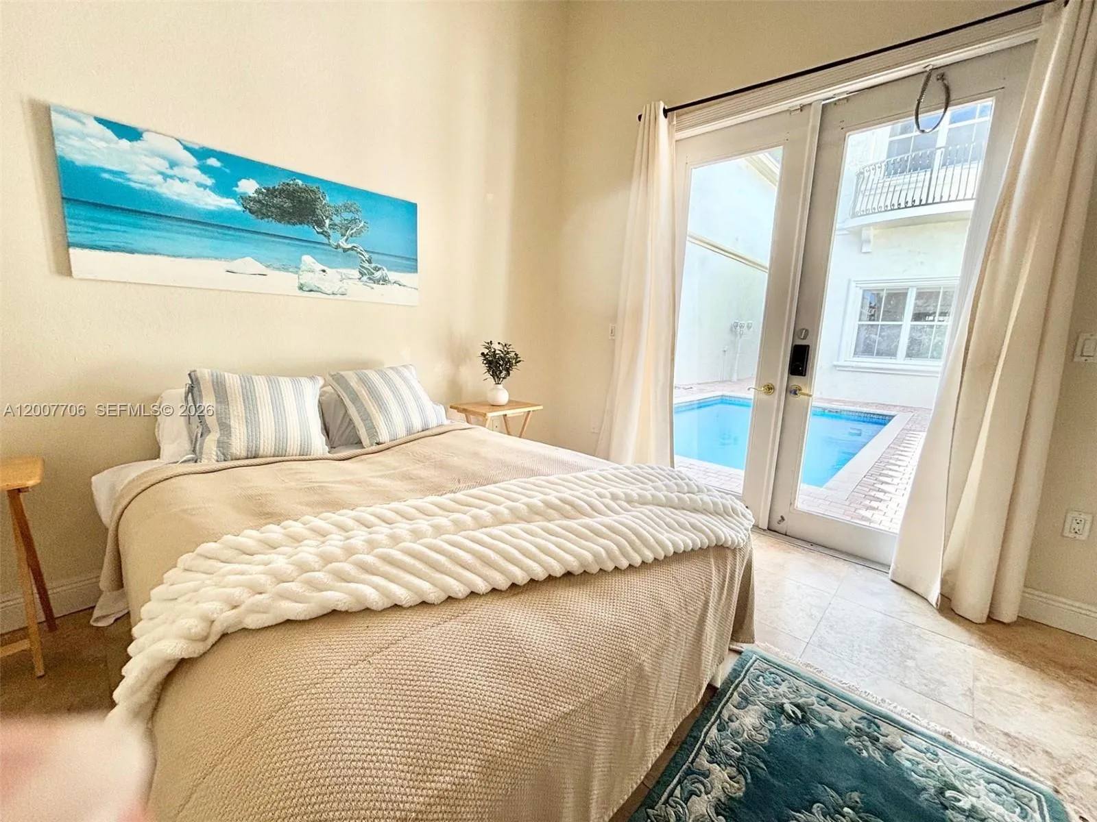 Guest house bedroom overlooking the pool