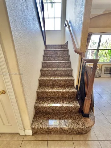 Granite staircase leading to the 2nd floor