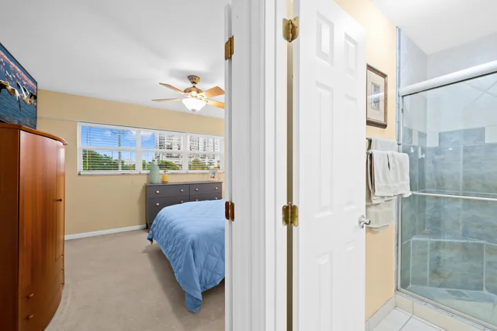 Bed and bathroom entry