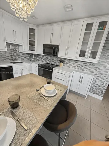 Spacious kitchen with island bar — ideal for entertaining and everyday living