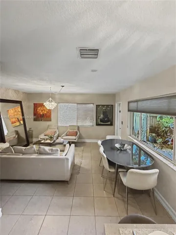 Dual-exposure corner windows flood the living space with natural light