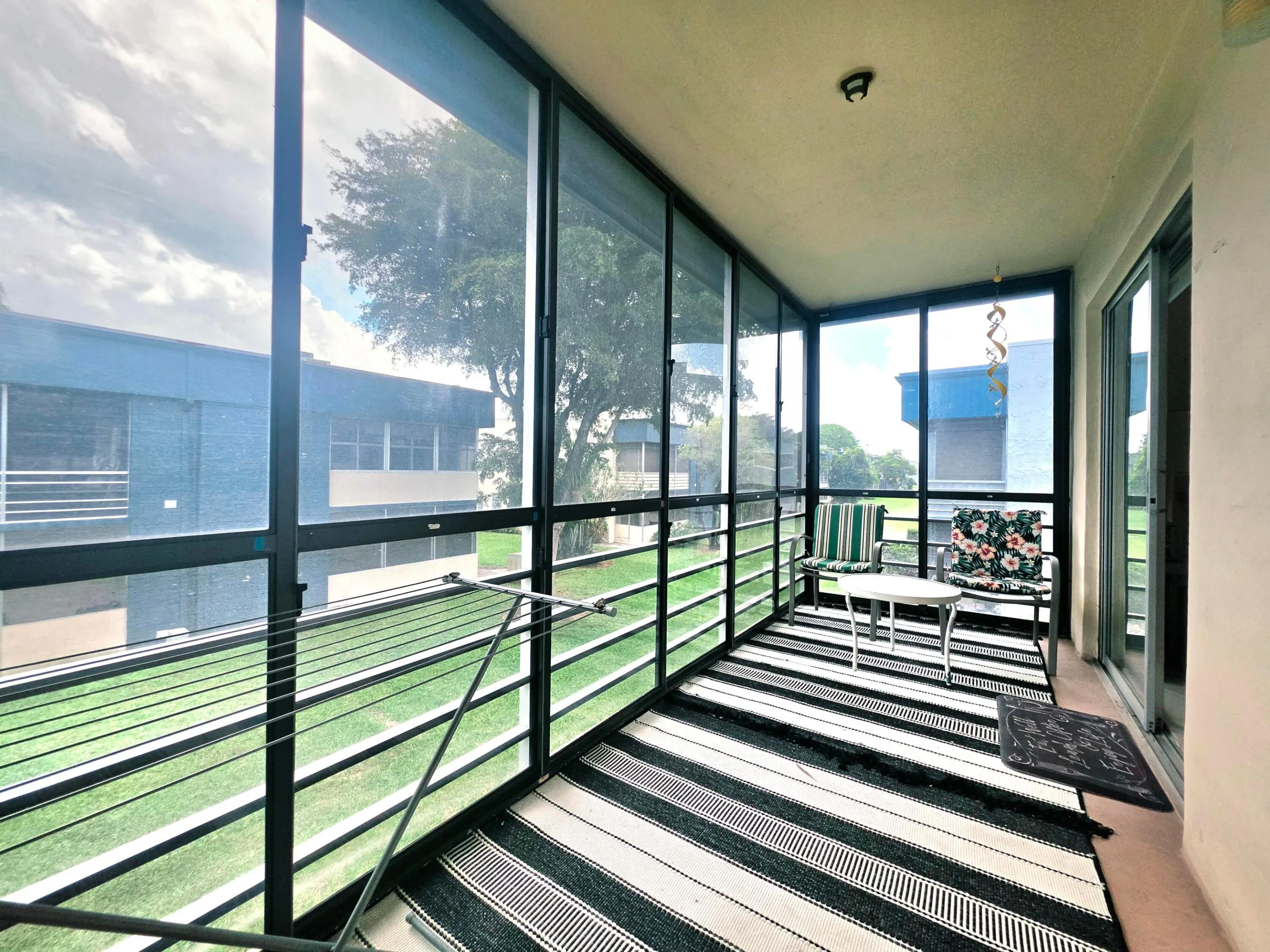 LARGE SCREENED IN BALCONY WITH GARDEN VIEW