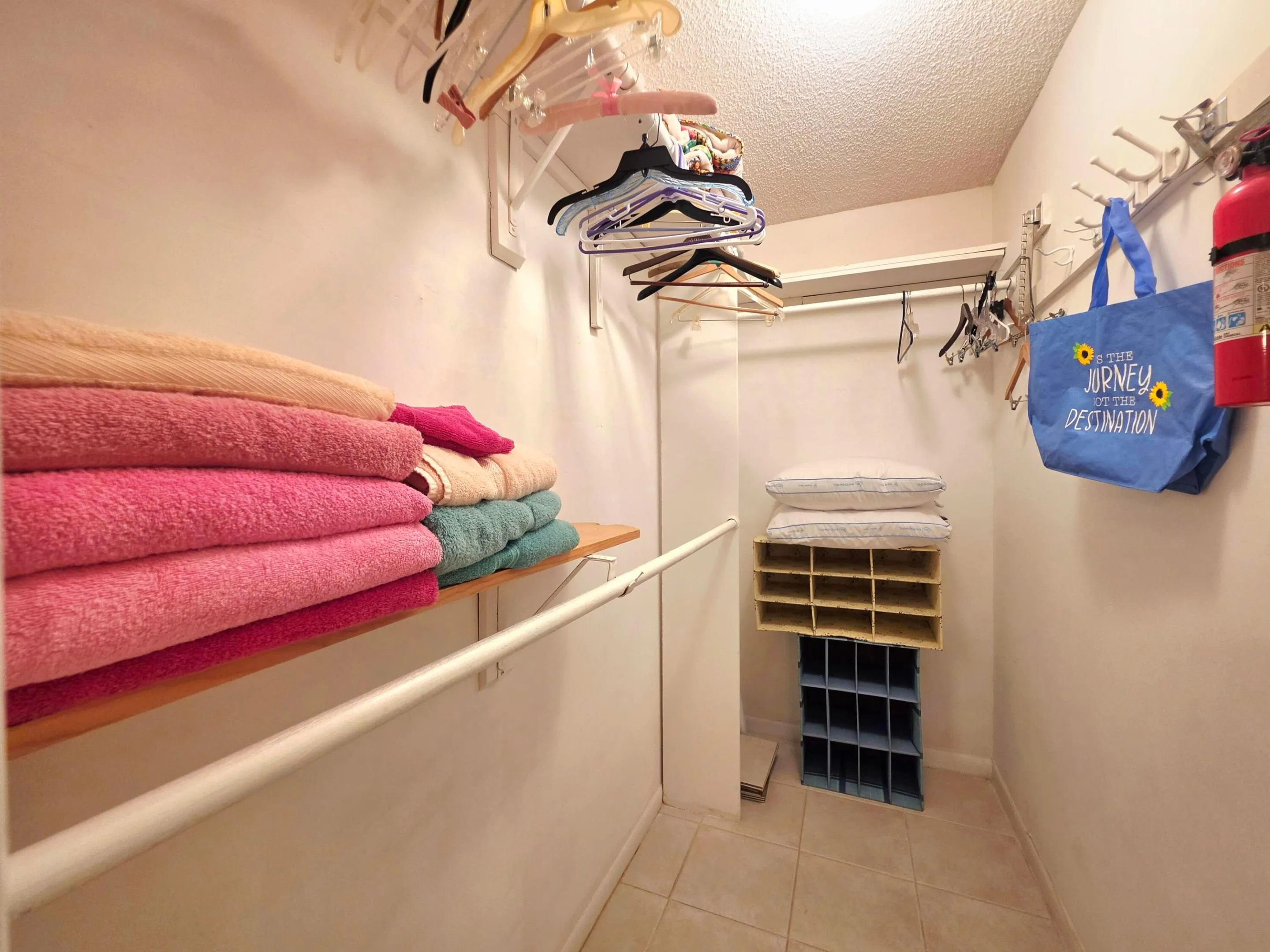 WALK-IN CLOSET IN THE PRIMARY BEDROOM