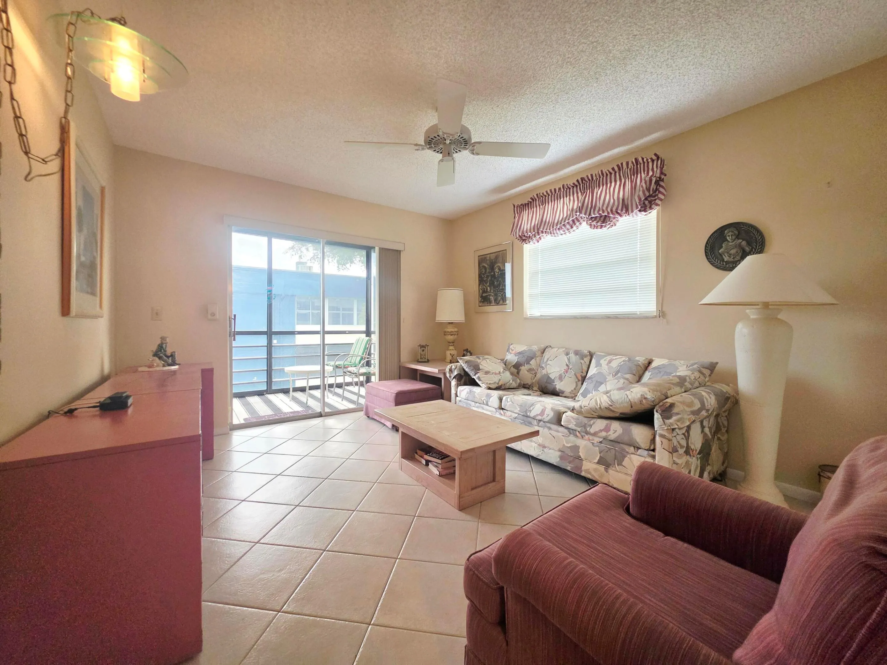 GUEST BEDROOM WITH SLIDING DOORS LEADING TO YOUR SCREENED IN BALCONY