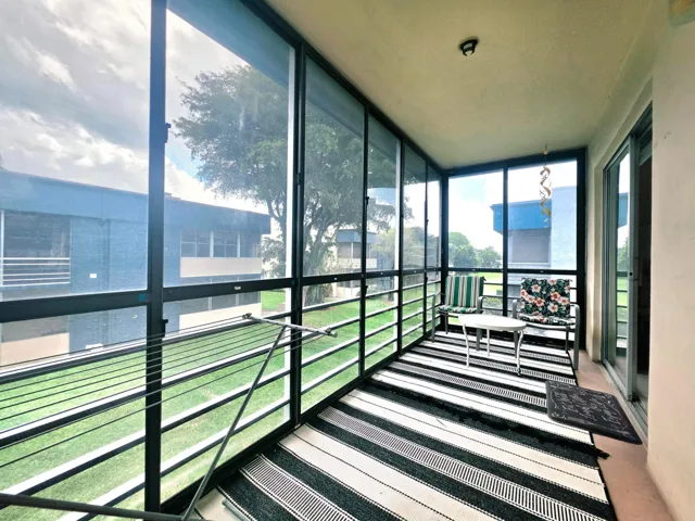 LARGE SCREENED IN BALCONY WITH GARDEN VIEW