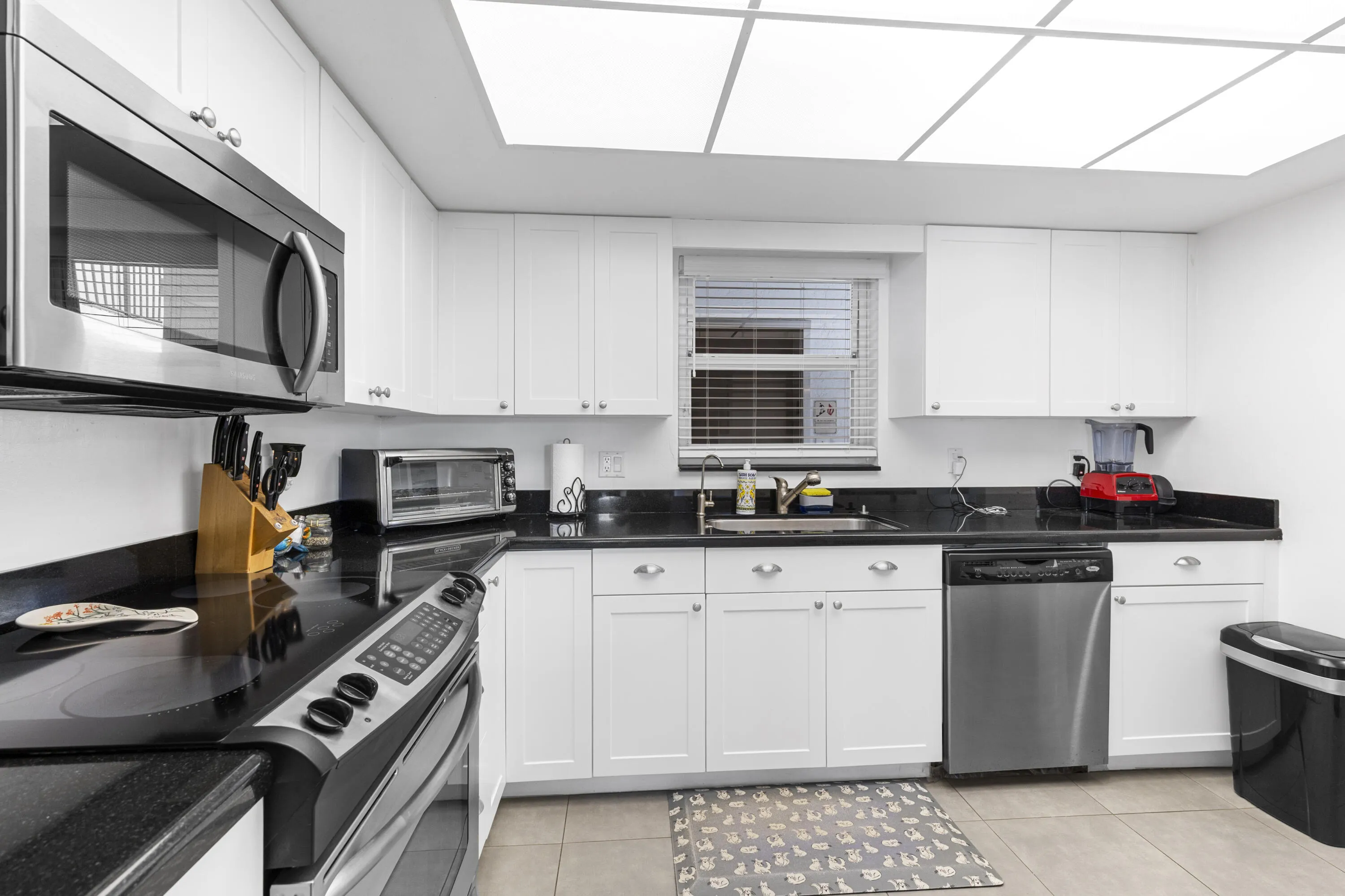 Large open plan kitchen with window and natural light