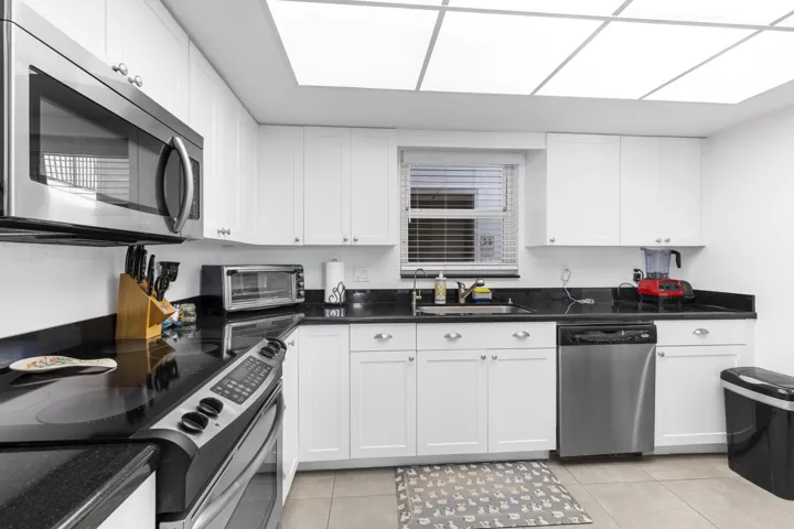 Large open plan kitchen with window and natural light