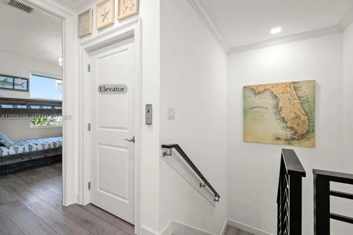 Landing to downstairs, elevator