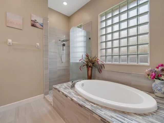 Seamless shower and soaking tub.
