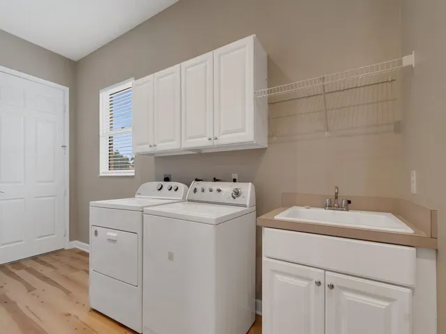 Large laundry room with utility sink