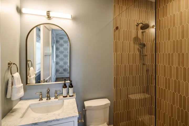 23 - Bathroom with blue-gray walls, gold