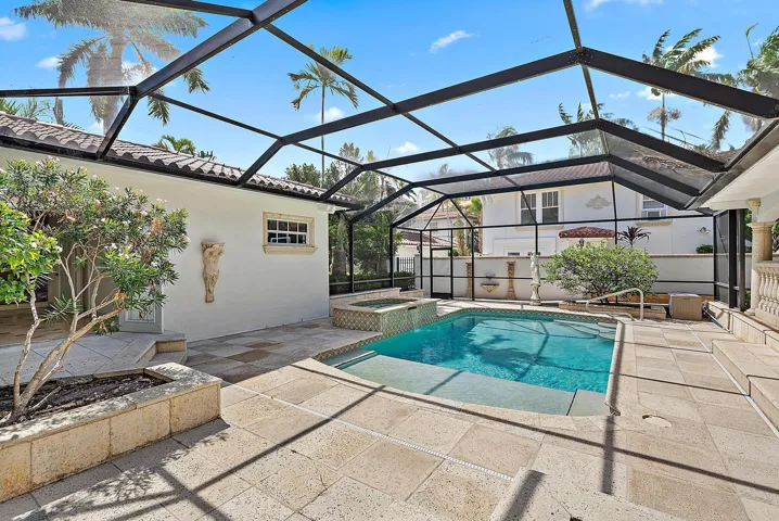 Sunny pool and spa fully screened.