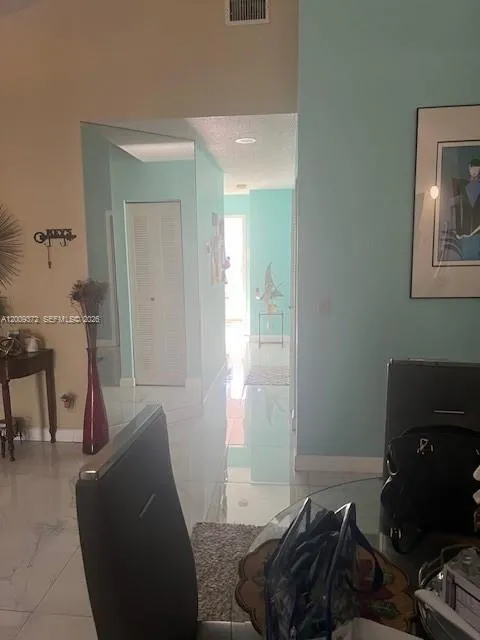 hallway leading to bedrooms 2 & 3 & garage