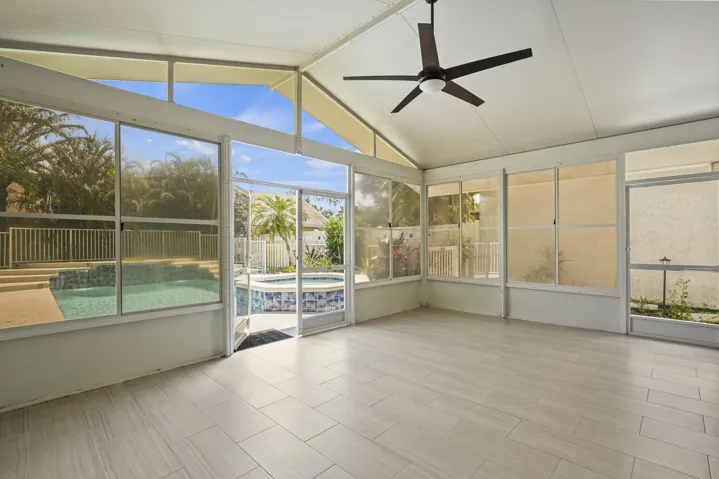 An inviting extension of the home, perfect for relaxing or entertaining year-round.