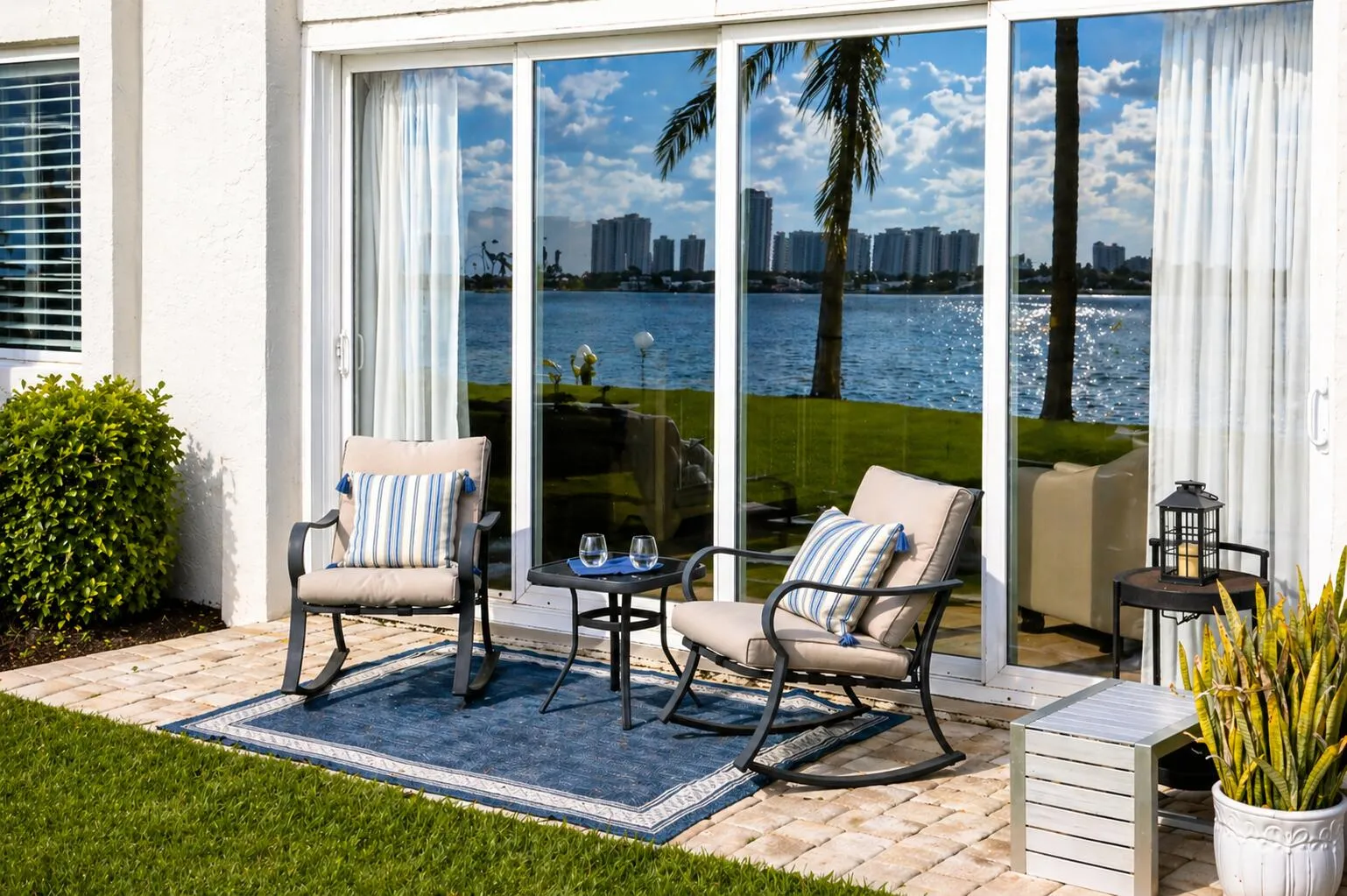 Private Patio – Ground-level outdoor living with direct access to lush lawn and Intracoastal views.