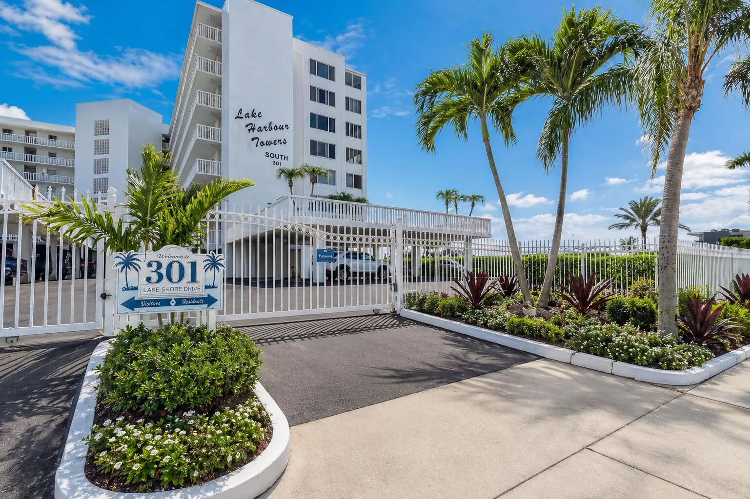 Gated Entrance – Secure entry with tropical landscaping and welcoming curb appeal.