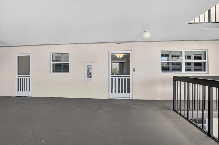 Right off the elevator, covered entryway