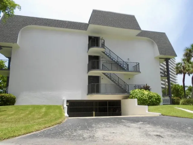 Building View South Side and Garage Entry
