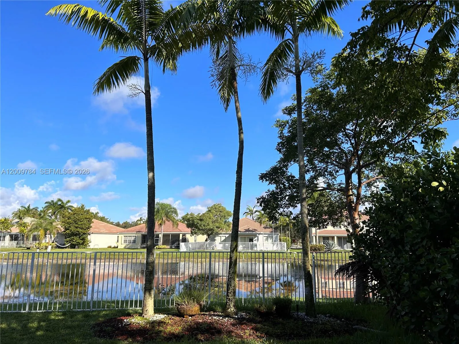 Huge fenced back yard with amazing panoramic lake views.