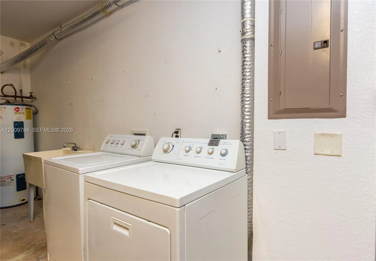 Laundry with sink in garage
