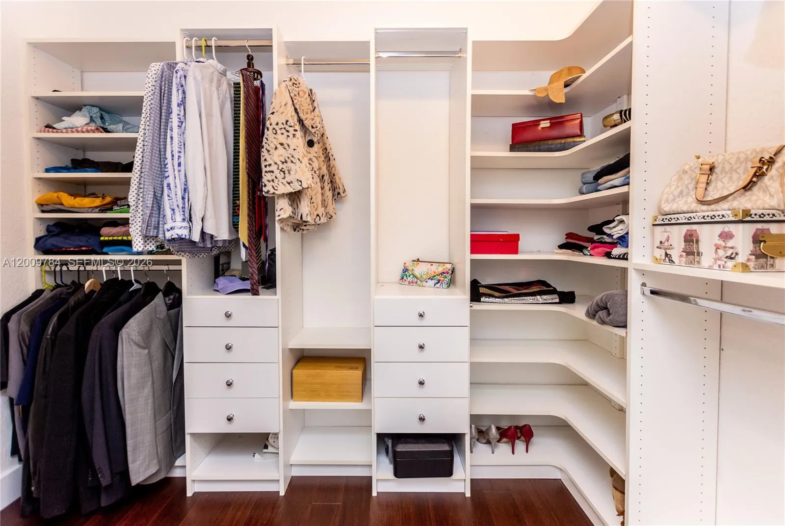 Open 1st floor master bedroom's walking closet with built-in closet spaces.