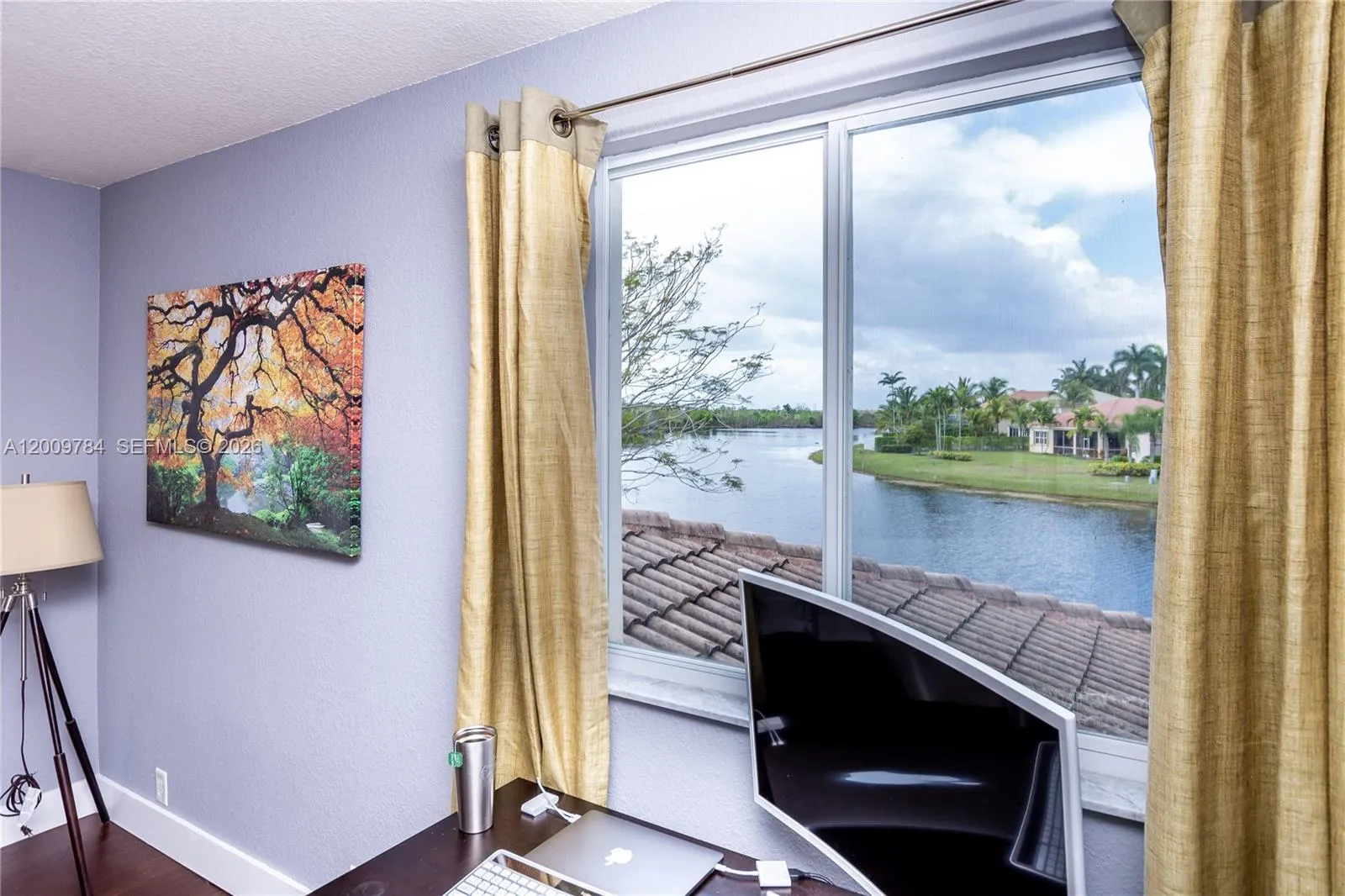 Beautiful 2nd floor bedroom with real wood dark floors and lake view.